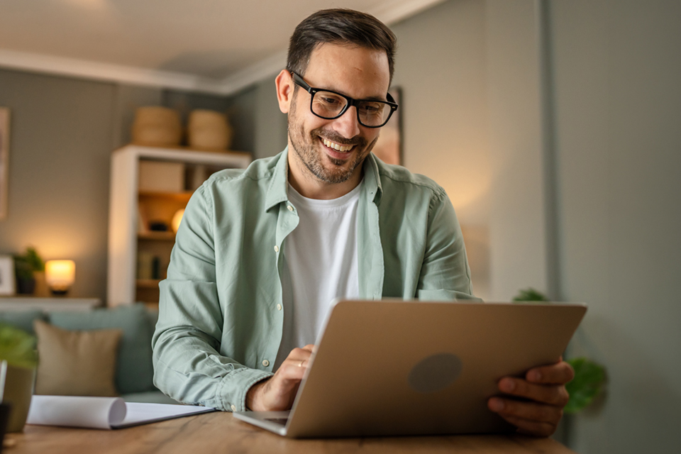 one man adult working on laptop